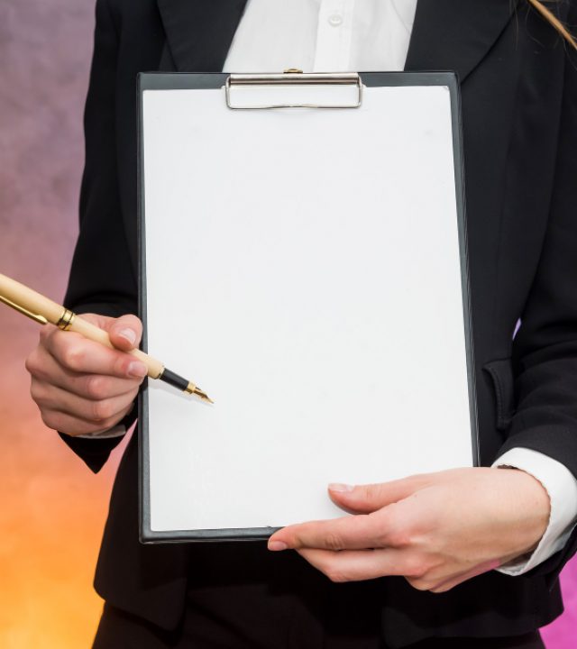 beautiful-woman-with-clipboard-offering-sign-contract-with-pen